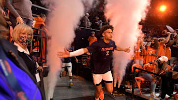 Nov 12, 2021; Champaign, Illinois, USA; Illinois Fighting Illini forward Benjamin Bosmans-Verdonk (13) runs through the smoke machine as he takes the court with teammates before the start of the first half against the Arkansas State Red Wolves at State Farm Center. Mandatory Credit: Ron Johnson-USA TODAY Sports