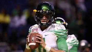 Dec 30, 2013; San Antonio, TX, USA; Oregon Ducks quarterback Marcus Mariota (8) warms up before the game against the Texas Longhorns at Alamo Dome. Mandatory Credit: Soobum Im-USA TODAY Sports
