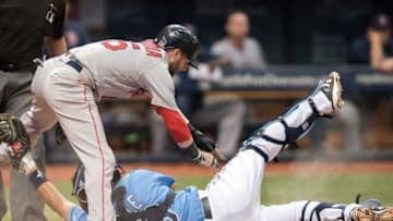 Sep 25, 2016; St. Petersburg, FL, USA; Boston Red Sox second baseman Dustin Pedroia (15) avoids the tag of Tampa Bay Rays catcher Luke Maile (46) to score the winning run in the tenth inning at Tropicana Field. Mandatory Credit: Jeff Griffith-USA TODAY Sports