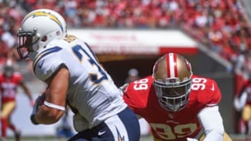 August 24, 2014; Santa Clara, CA, USA; San Francisco 49ers outside linebacker Aldon Smith (99) tackles San Diego Chargers running back Donald Brown (34) during the first quarter at Levi's Stadium. The 49ers defeated the Chargers 21-7. Mandatory Credit: Kyle Terada-USA TODAY Sports