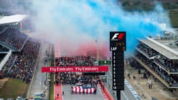 Oct 25, 2015; Austin, TX, USA; Red white and blue smoke is set off before the start of the United States Grand Prix at the Circuit of the Americas. Mandatory Credit: Jerome Miron-USA TODAY Sports