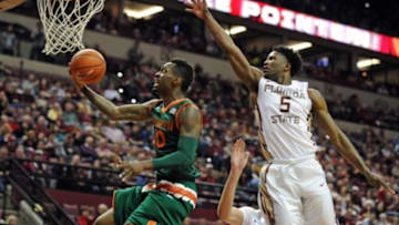 Feb 14, 2016; Tallahassee, FL, USA; Miami Hurricanes guard Sheldon McClellan (10) shoots the ball past Florida State Seminoles guard Malik Beasley (5) during the first half of the game at the Donald L. Tucker Center. Mandatory Credit: Melina Vastola-USA TODAY Sports