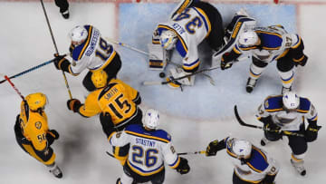 Dec 13, 2016; Nashville, TN, USA; St. Louis Blues goalie Jake Allen (34) makes a save in traffic during the second period against the Nashville Predators at Bridgestone Arena. Mandatory Credit: Christopher Hanewinckel-USA TODAY Sports