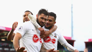 BOURNEMOUTH, ENGLAND - DECEMBER 03: Charlie Austin of Southampton celebrates after scoring his sides first goal with Sofiane Boufal of Southampton and Ryan Bertrand of Southampton during the Premier League match between AFC Bournemouth and Southampton at Vitality Stadium on December 3, 2017 in Bournemouth, England. (Photo by Clive Rose/Getty Images)
