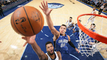 MEMPHIS, TN - NOVEMBER 1: Andrew Harrison #5 of the Memphis Grizzlies goes to the basket against Aaron Gordon #00 of the Orlando Magic on November 1, 2017 at FedExForum in Memphis, Tennessee. NOTE TO USER: User expressly acknowledges and agrees that, by downloading and or using this photograph, User is consenting to the terms and conditions of the Getty Images License Agreement. Mandatory Copyright Notice: Copyright 2017 NBAE (Photo by Joe Murphy/NBAE via Getty Images)