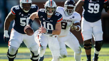Auburn football quarterback Bo Nix (10) runs the ball at Jordan-Hare Stadium in Auburn, Ala., on Saturday, Dec. 5, 2020. Texas A&M defeated Auburn 31-20.