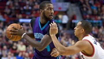 Jan 29, 2016; Portland, OR, USA; Charlotte Hornets forward Michael Kidd-Gilchrist (14) looks to pass around Portland Trail Blazers guard C.J. McCollum (3) during the first quarter at the Moda Center. Mandatory Credit: Craig Mitchelldyer-USA TODAY Sports