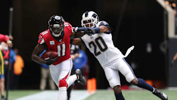 Oct 20, 2019; Atlanta, GA, USA; Atlanta Falcons wide receiver Julio Jones (11) carries the ball as Los Angeles Rams cornerback Jalen Ramsey (20) defends in the second half at Mercedes-Benz Stadium. Mandatory Credit: Jason Getz-USA TODAY Sports