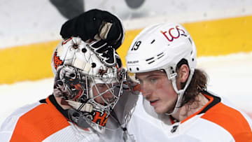 NEWARK, NEW JERSEY - JANUARY 28: Carter Hart #79 and Nolan Patrick #19 of the Philadelphia Flyers celebrate their 3-1 victory over the New Jersey Devils at the Prudential Center on January 28, 2021 in Newark, New Jersey. (Photo by Bruce Bennett/Getty Images)
