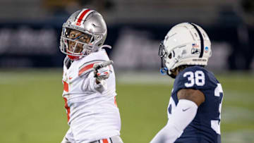 STATE COLLEGE, PA - OCTOBER 31: Garrett Wilson #5 of the Ohio State Buckeyes reacts after a play against Lamont Wade #38 of the Penn State Nittany Lions during the first half at Beaver Stadium on October 31, 2020 in State College, Pennsylvania. (Photo by Scott Taetsch/Getty Images)