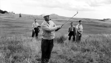 Golf; British Open Championships, St Andrews, Scotland, July 1957, Irish golfer Harry Bradshaw is pictured after chipping out of rough, watched by spectators (Photo by Bob Thomas/Getty Images)