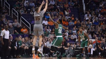 Mar 26, 2016; Phoenix, AZ, USA; Phoenix Suns forward Mirza Teletovic (35) shoots over Boston Celtics forward Amir Johnson (90) during the first half at Talking Stick Resort Arena. Mandatory Credit: Joe Camporeale-USA TODAY Sports