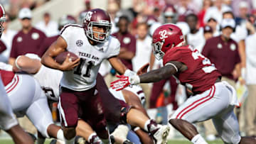 TUSCALOOSA, AL - SEPTEMBER 22: Kellen Mond #11 of the Texas A&M Aggies runs the ball and tries to avoid the tackle of Dylan Moses #32 of the Alabama Crimson Tide at Bryant-Denny Stadium on September 22, 2018 in Tuscaloosa, Alabama. The Crimson Tide defeated the Aggies 45-23. (Photo by Wesley Hitt/Getty Images)