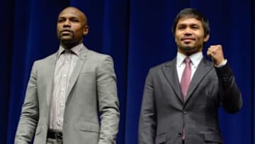 Mar 11, 2015; Los Angeles, CA, USA; Floyd Mayweather (left) and Manny Pacquiao during a press conference to announce their fight on May 2, 2015 at the Nokia Theater in Los Angeles. Mandatory Credit: Robert Hanashiro-USA TODAY Sports