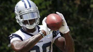 Jun 17, 2014; Dallas, TX, USA; Dallas Cowboys receiver Dez Bryant (88) catches footballs for a drill during minicamp at Cowboys headquarters at Valley Ranch. Mandatory Credit: Matthew Emmons-USA TODAY Sports