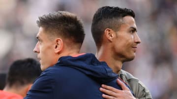 Juventus' Portuguese forward Cristiano Ronaldo (R) and Genoa's Polish forward Krzysztof Piatek embrace prior to the Italian Serie A football match Juventus vs Genoa on October 20, 2018 at the Juventus Allianz stadium in Turin. (Photo by Marco BERTORELLO / AFP) (Photo credit should read MARCO BERTORELLO/AFP/Getty Images)