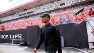 Sep 7, 2014; Tampa, FL, USA; Carolina Panthers quarterback Cam Newton (1), who was declared inactive due to an injury, walks onto the field before the game against the Tampa Bay Buccaneers at Raymond James Stadium. Mandatory Credit: David Manning-USA TODAY Sports