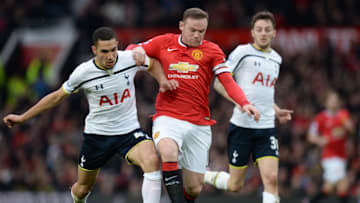 Manchester United's English striker Wayne Rooney (C) is challenged by Tottenham Hotspur's French midfielder Nabil Bentaleb (L) as Tottenham Hotspur's English midfielder Ryan Mason (R) looks on during the English Premier League football match between Manchester United and Tottenham Hotspur at Old Trafford in Manchester, North West England on March 15, 2015. AFP PHOTO / OLI SCARFFRESTRICTED TO EDITORIAL USE. NO USE WITH UNAUTHORIZED AUDIO, VIDEO, DATA, FIXTURE LISTS, CLUB/LEAGUE LOGOS OR LIVE SERVICES. ONLINE IN-MATCH USE LIMITED TO 45 IMAGES, NO VIDEO EMULATION. NO USE IN BETTING, GAMES OR SINGLE CLUB/LEAGUE/PLAYER PUBLICATIONS. (Photo credit should read OLI SCARFF/AFP/Getty Images)