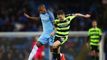 MANCHESTER, ENGLAND - MARCH 01: Fernandinho of Manchester City and Jack Payne of Huddersfield Town battle for the ball during The Emirates FA Cup Fifth Round Replay match between Manchester City and Huddersfield Town at Etihad Stadium on March 1, 2017 in Manchester, England. (Photo by Clive Brunskill/Getty Images)