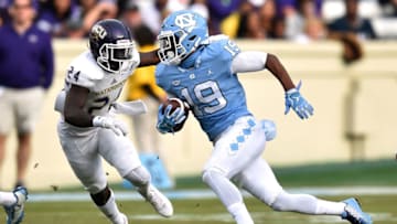 CHAPEL HILL, NC - NOVEMBER 18: Dazz Newsome #19 of the North Carolina Tar Heels runs with the ball against Shamon Elliott #24 of the Western Carolina Catamounts at Kenan Stadium on November 18, 2017 in Chapel Hill, North Carolina. (Photo by Lance King/Getty Images)