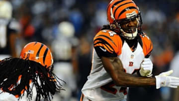 December 2, 2012; San Diego, CA, USA; Cincinnati Bengals cornerback Adam Jones (24) celebrates with safety Reggie Nelson (20) after an interception in the end zone during the fourth quarter against the San Diego Chargers at Qualcomm Stadium. The Bengals won 20-13. Mandatory Credit: Christopher Hanewinckel-USA TODAY Sports
