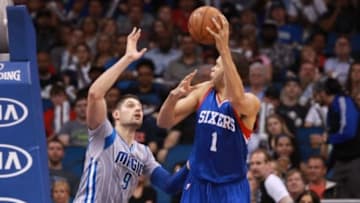 Feb 22, 2015; Orlando, FL, USA; Philadelphia 76ers center JaVale McGee (1) drives to the basket as Orlando Magic center Nikola Vucevic (9) defends during the second half at Amway Center. Orlando Magic defeated the Philadelphia 76ers 103-98. Mandatory Credit: Kim Klement-USA TODAY Sports