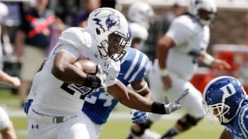 Sep 19, 2015; Durham, NC, USA; Northwestern Wildcats running back Justin Jackson (21) runs the ball against Duke Blue Devils safety Jeremy Cash (16) in their game at Wallace Wade Stadium. Mandatory Credit: Mark Dolejs-USA TODAY Sports