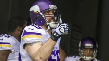 Dec 22, 2013; Cincinnati, OH, USA; Minnesota Vikings defensive end Jared Allen (69) in the tunnel gives a thumbs up to a fan before he takes the field against the Cincinnati Bengals at Paul Brown Stadium. Cincinnati Bengals beat the Minnesota Vikings by the score of 42-14. Mandatory Credit: Trevor Ruszkowksi-USA TODAY Sports