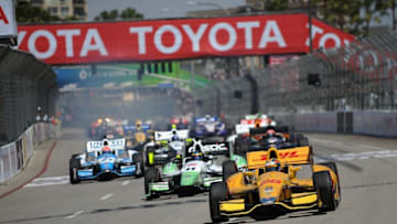 LONG BEACH, CA - APRIL 13: Ryan Hunter-Reay, driver of the #28 Andretti Autosport Dallara Honda, leads a pack of cars on the track during the Verizon IndyCar Series Toyota Grand Prix of Long Beach on April 13, 2014 on the streets of Long Beach, California. (Photo by Jonathan Moore/Getty Images)