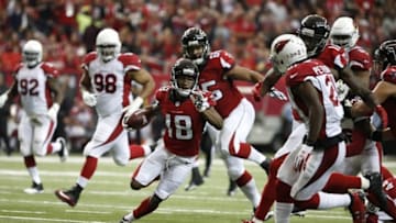 Nov 27, 2016; Atlanta, GA, USA; Atlanta Falcons wide receiver Taylor Gabriel (18) runs after a catch for a touchdown in the second quarter of their game against the Arizona Cardinals at the Georgia Dome. Mandatory Credit: Jason Getz-USA TODAY Sports
