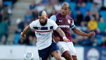 TELFORD, ENGLAND - JULY 12: Shane Sutton of AFC Telford United competes with Gabriel Agbonlahor of Aston Villa during the Pre-Season Friendly between AFC Telford United and Aston Villa at New Bucks Head Stadium on July 12, 2017 in Telford, England. (Photo by Malcolm Couzens/Getty Images)