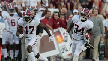 COLLEGE STATION, TX - OCTOBER 07: Damien Harris #34 of the Alabama Crimson Tide runs for a 75 yard touchdown as Cam Sims #17 attempts to get out in front for a block in the first quarter against the Texas A&M Aggies at Kyle Field on October 7, 2017 in College Station, Texas. (Photo by Bob Levey/Getty Images)