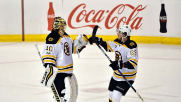 Jan 7, 2017; Sunrise, FL, USA; Boston Bruins goalie Tuukka Rask (left) celebrates with Boston Bruins left wing David Pastrnak (right) after defeating the Florida Panthers 4-0 at BB&T Center. Mandatory Credit: Steve Mitchell-USA TODAY Sports