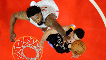 LOS ANGELES, CA - FEBRUARY 22: DeAndre Jordan #6 of the Los Angeles Clippers blocks a layup against Devin Booker #1 of the Phoenix Suns during the first half of the basketball game at Staples Center February 22, 2016, in Los Angeles, California. NOTE TO USER: User expressly acknowledges and agrees that, by downloading and or using the photograph, User is consenting to the terms and conditions of the Getty Images License Agreement. (Photo by Kevork Djansezian/Getty Images)