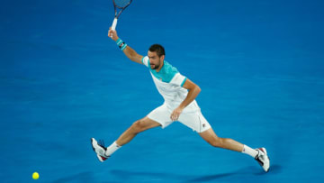 MELBOURNE, AUSTRALIA - JANUARY 25: Marin Cilic of Croatia plays a forehand in his semi-final match against Kyle Edmund of Great Britain on day 11 of the 2018 Australian Open at Melbourne Park on January 25, 2018 in Melbourne, Australia. (Photo by Scott Barbour/Getty Images)
