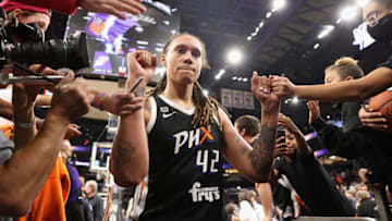 PHOENIX, ARIZONA - OCTOBER 13: Brittney Griner #42 of the Phoenix Mercury celebrates with fans following Game Two of the 2021 WNBA Finals at Footprint Center on October 13, 2021 in Phoenix, Arizona. The Mercury defeated the Sky 91-86 in overtime. NOTE TO USER: User expressly acknowledges and agrees that, by downloading and or using this photograph, User is consenting to the terms and conditions of the Getty Images License Agreement. (Photo by Christian Petersen/Getty Images)