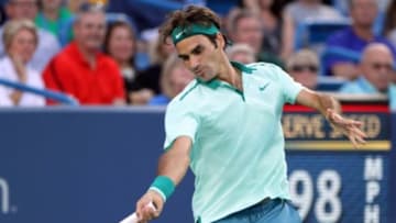 Aug 14, 2014; Cincinnati, OH, USA; Roger Federer returns the shot of Gael Monfils on day four of the Western and Southern Open tennis tournament at Linder Family Tennis Center. Mandatory Credit: Mark Zerof-USA TODAY Sports