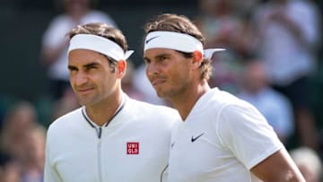 LONDON, ENGLAND - JULY 12: Roger Federer of Switzerland and Rafael Nadal of Spain pose at the net before their semi final match during Day Eleven of The Championships - Wimbledon 2019 at All England Lawn Tennis and Croquet Club on July 12, 2019 in London, England. (Photo by Visionhaus/Getty Images)