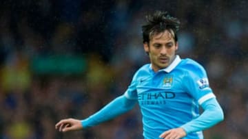 David Silva running through the rain at Goodison Park en route to a 2-0 victory over Everton and a ninth consecutive win for Manchester City (via Manchester City Facebook)