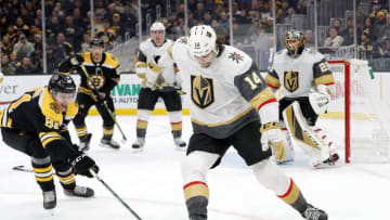 BOSTON, MA - JANUARY 21: A sticklers Vegas Golden Knights defenseman Nicolas Hague (14) tries to kick the puck away from Boston Bruins left wing Anton Blidh (81) during a game between the Boston Bruins and the Vegas Golden Knights on January 21, 2020, at TD Garden in Boston, Massachusetts. (Photo by Fred Kfoury III/Icon Sportswire via Getty Images)
