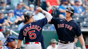 KANSAS CITY, MISSOURI - JUNE 19: Bobby Dalbec #29 of the Boston Red Sox is congratulated by Enrique Hernandez #5 after hitting a two-run home run during the 9th inning of the game against the Kansas City Royals at Kauffman Stadium on June 19, 2021 in Kansas City, Missouri. (Photo by Jamie Squire/Getty Images)