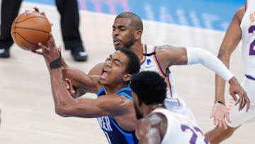 May 2, 2021; Oklahoma City, Oklahoma, USA; Oklahoma City Thunder guard Theo Maledon (11) is fouled by Phoenix Suns guard Chris Paul (3) during the third quarter at Chesapeake Energy Arena. Mandatory Credit: Alonzo Adams-USA TODAY Sports