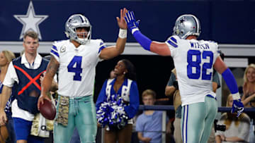 ARLINGTON, TX - NOVEMBER 05: Dak Prescott #4 of the Dallas Cowboys gets a high five from Terrance Williams #83 of the Dallas Cowboys after scrabling for a first down in the second half of a football game against the Kansas City Chiefs at AT&T Stadium on November 5, 2017 in Arlington, Texas. (Photo by Ron Jenkins/Getty Images)