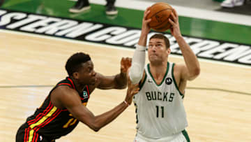 Jul 1, 2021; Milwaukee, Wisconsin, USA; Milwaukee Bucks center Brook Lopez (11) shoots against Atlanta Hawks center Clint Capela (15) during the first quarter during game five of the Eastern Conference Finals for the 2021 NBA Playoffs at Fiserv Forum. Mandatory Credit: Jeff Hanisch-USA TODAY Sports