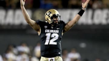 BOULDER, COLORADO - NOVEMBER 23: Quarterback Steven Montez #12 of the Colorado Buffaloes celebrates throwing a touchdown against the Washington Huskies in the second quarter at Folsom Field on November 23, 2019 in Boulder, Colorado. (Photo by Matthew Stockman/Getty Images)