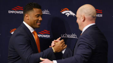 ENGLEWOOD, CO - MARCH 16: Quarterback Russell Wilson #3 of the Denver Broncos shakes hands with head coach Nathaniel Hackett during an introductory press conference at UCHealth Training Center on March 16, 2022 in Englewood, Colorado. (Photo by Justin Edmonds/Getty Images)