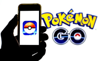 BARCELONA, CATALONIA, SPAIN - 2021/07/26: In this photo illustration a Pokémon GO app seen displayed on a smartphone and in the background. (Photo Illustration by Thiago Prudêncio/SOPA Images/LightRocket via Getty Images)
