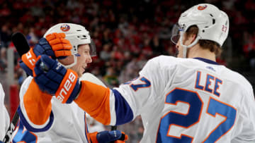 NEWARK, NJ - MARCH 31: Tanner Fritz #56 of the New York Islanders is congratulated by teammate Anders Lee #27 after Fritz scored in the first peirod against the New Jersey Devils on March 31, 2018 at Prudential Center in Newark, New Jersey. (Photo by Elsa/Getty Images)