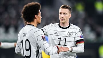 Marco Reus celebrates with Leroy Sané. (Photo by Thomas Eisenhuth/Getty Images)