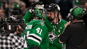 Nov 1, 2022; Dallas, Texas, USA; Dallas Stars goaltender Scott Wedgewood (41) and left wing Jamie Benn (14) celebrate the Stars victory over the Los Angeles Kings at the American Airlines Center. Mandatory Credit: Jerome Miron-USA TODAY Sports